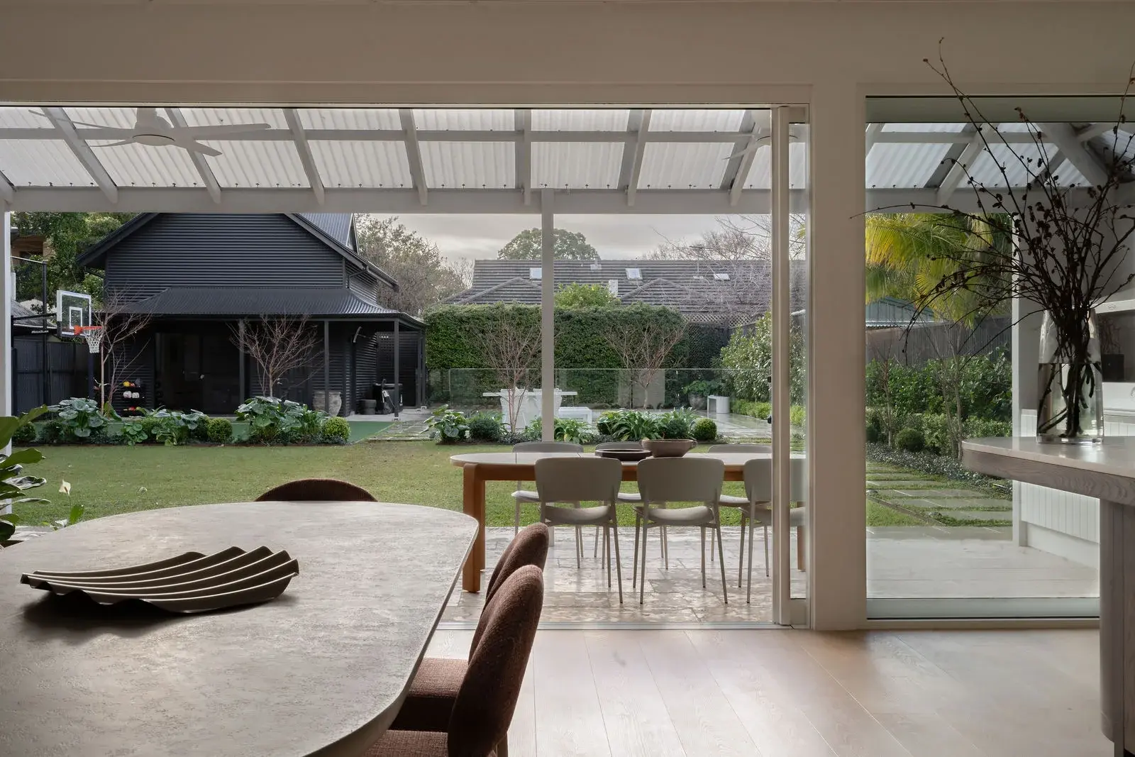 View through sliding doors to the alfresco terrace and guest residence