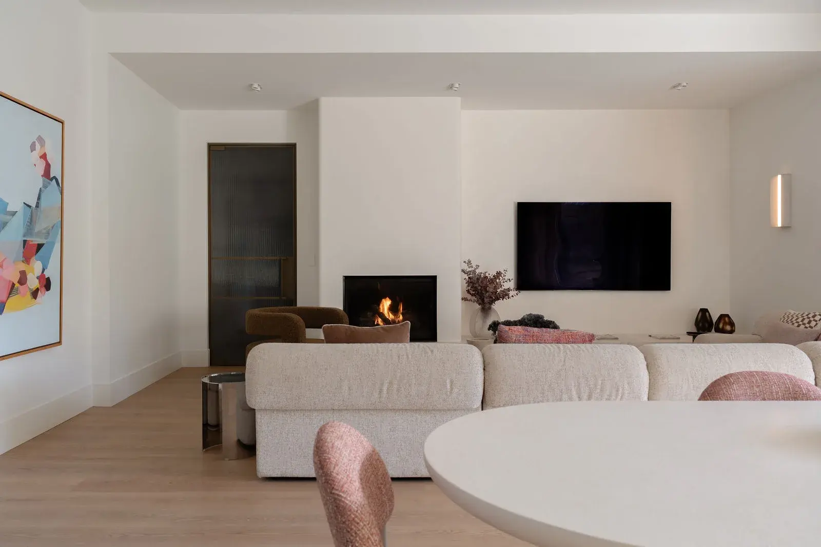 Family living room with the Lopi fire burning in its Venetian plaster surround